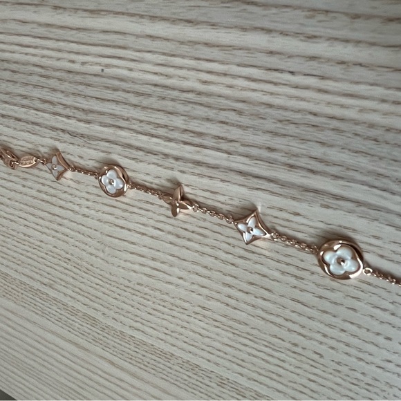 Luis Vuitton Elegant Gold and White Floral Bracelet - Picture 1 of 6